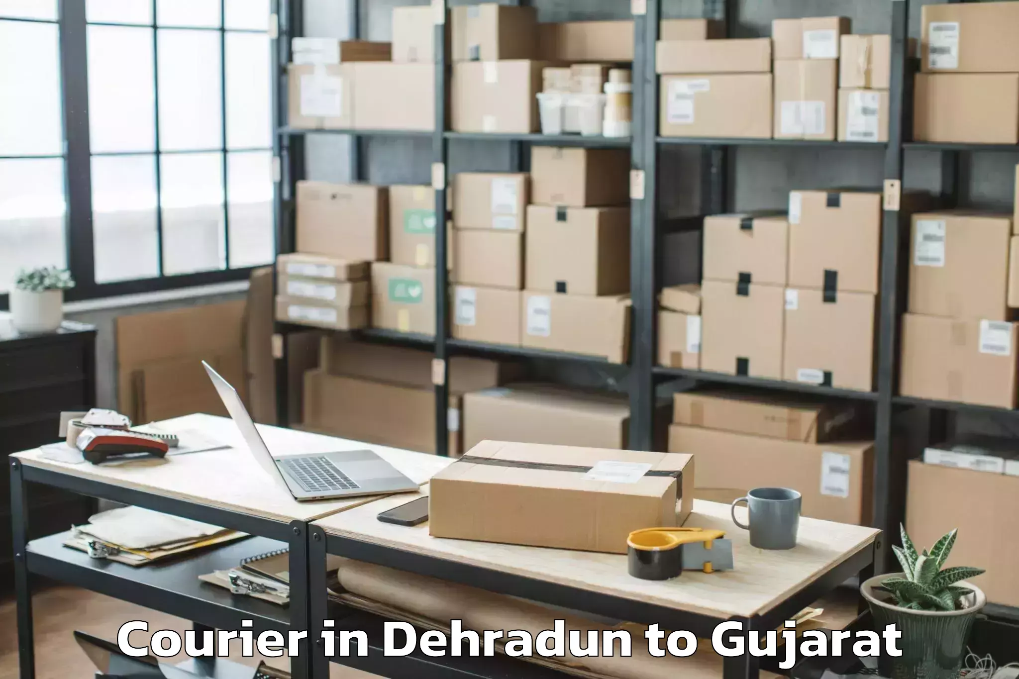 Reliable Dehradun to Keshod Courier